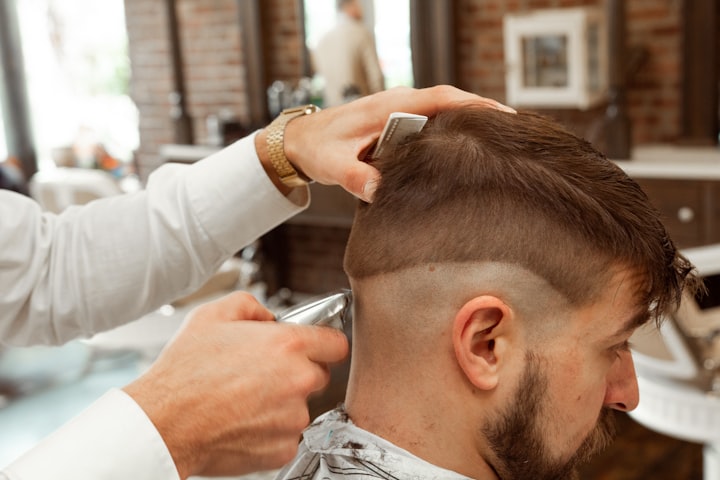 Barber giving a client a haircut
