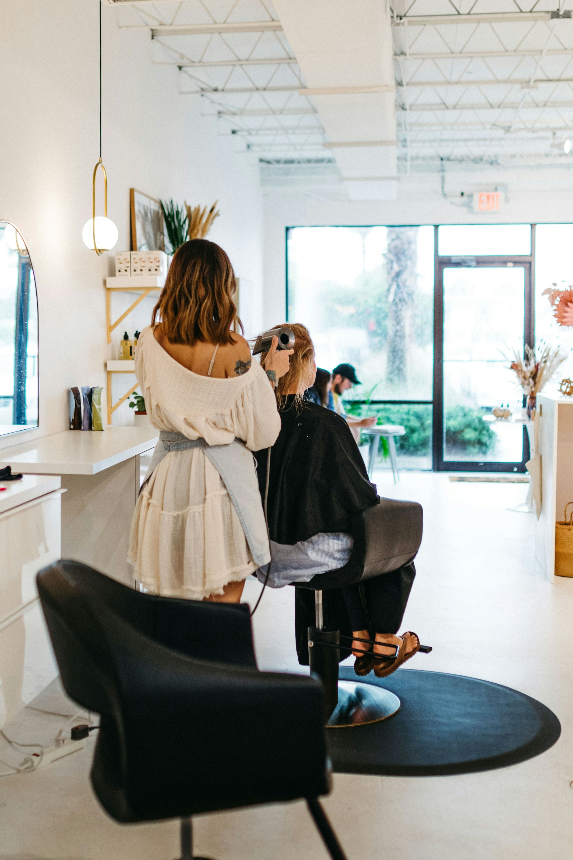 Stylist with a client in a modern salon