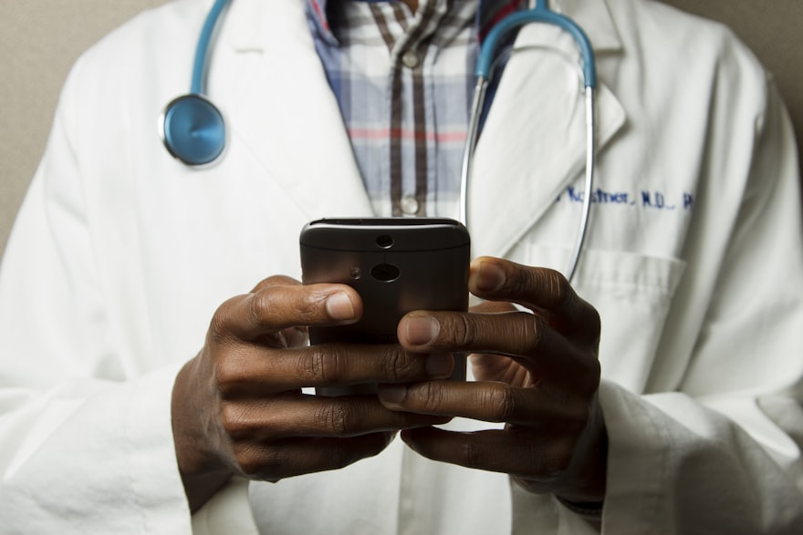 Doctor managing patient flow on a tablet
