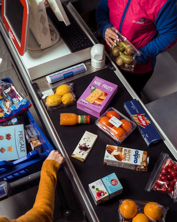 Groceries being scanned at a supermarket checkout