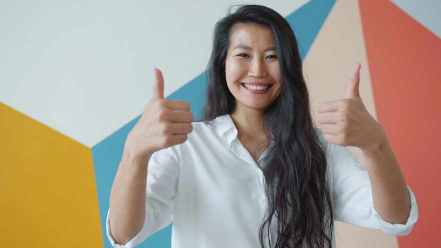 Happy customer giving a five-star thumbs-up review