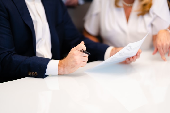 Insurance advisor reviewing a policy with a client