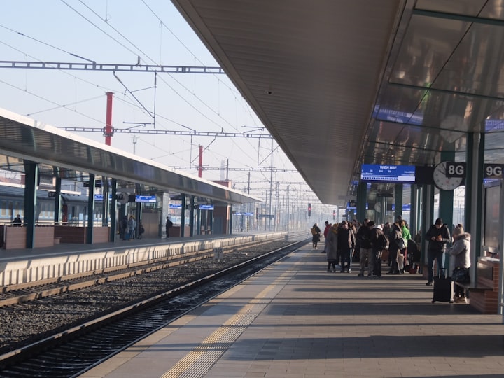 Travelers on a train station platform